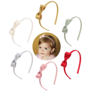 Set of 6 colorful girls' bow headbands in various spring colors on a white background