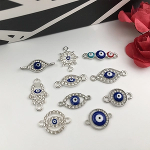 Assorted evil eye charms in silver metal and colorful resin for DIY jewelry making