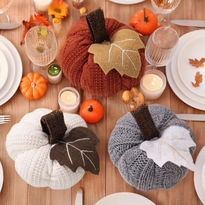 Three-piece knitted pumpkin decor set in rust red, cream and grey for harvest festival