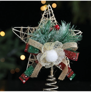 Detailed view of rustic metal star tree topper with pine needles, berries and a plaid bow