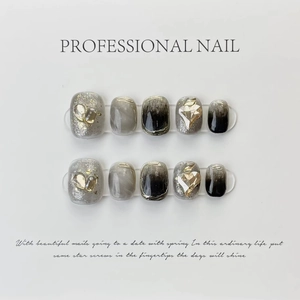 Elegant handmade black ombre press-on nails featuring gold heart rhinestones, 10pcs