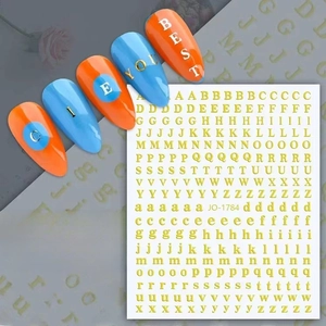 Detail view of gold alphabet nail stickers JO-1784 with metallic embossing and application