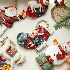 Hand-painted resin Christmas ornaments featuring Santa Claus, reindeer and rocking horse