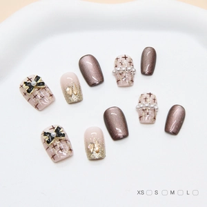 Handmade brown cat-eye press-on nails with 3D bows, pearls and champagne diamonds set