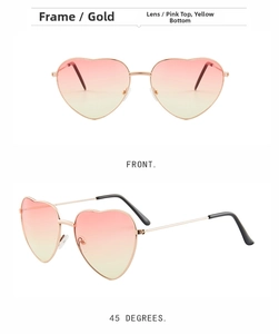 Close-up of heart-shaped sunglasses with gold metal frames and pink-yellow gradient lenses