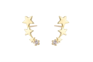 Detail of three-star gold ear climbers with cubic zirconia on white background