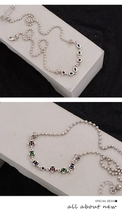 Close-up of S925 sterling silver beaded chain necklace with colorful zircon gemstones