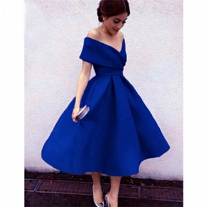 Elegant royal blue off-shoulder evening dress with a cinched waist and pleated skirt