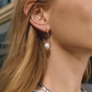 Silver stainless steel C-hoop earrings featuring white baroque freshwater pearl pendants