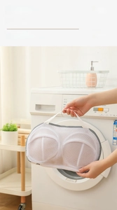 Macro detail of thick sandwich mesh laundry bag for bras with portable handle strap