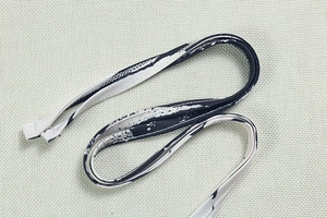 Detailed view of elastic fabric straps with zebra print and professional stitching