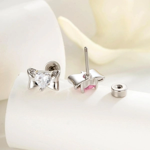 Silver bow stud earrings with heart zirconia stones and secure screw back closure