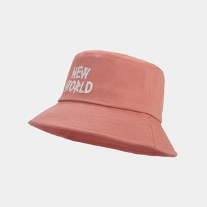 Detail of NEW WORLD embroidery on a pink cotton twill bucket hat with high-quality texture