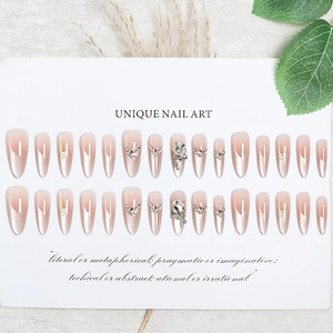Press-on nail set with pearlescent pink gradient, 3D rhinestones and bows