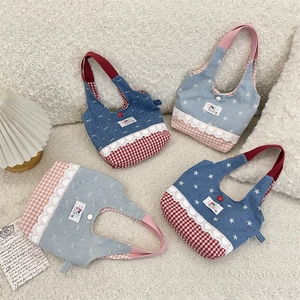 Detailed flat lay of small denim tote bags with lace trim and star patterns on faux fur