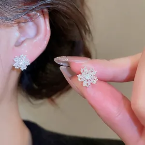 Sparkling snowflake zircon stud earrings for women with elegant silver finish