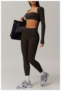 Three-piece dark coffee yoga set including sports bra, cropped top, and high-waist leggings