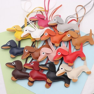 Detailed view of colorful leather dachshund charms with high-quality stitching and lanyards