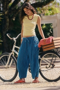 Detail shot of blue striped wide leg pants with breathable linen texture and elastic waist