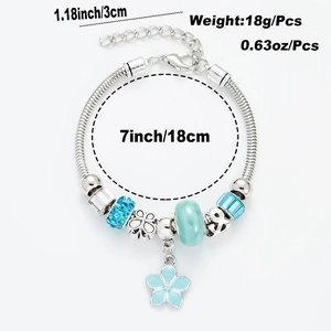 Silver four-leaf clover bracelet with sky blue glass beads and size info labels