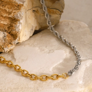 Detail of two-tone necklace with gold circular links and silver twisted rope chain