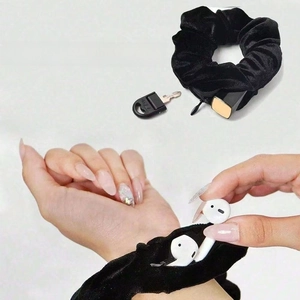 Black velvet scrunchie with hidden zipper pocket for small jewelry storage