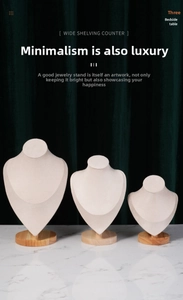 Three-piece beige velvet necklace busts with wooden bases for jewelry store displays