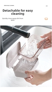 Close-up of removable double-layer soap box being rinsed under water for easy cleaning