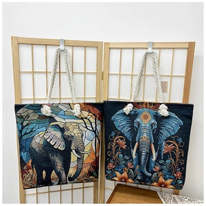 Close-up of artistic elephant print canvas tote bags with thick cotton rope handles