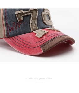 Close-up of vintage denim baseball cap with number 76 embroidery and distressed edges