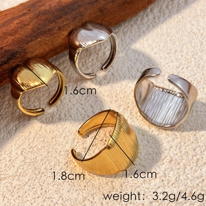 Gold and silver stainless steel heart rings with ribbed texture and size parameters