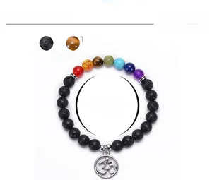 Detailed view of 8mm lava rock beads and Om charm on 7 chakra healing bracelet