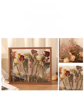 Detail of wooden double-sided glass frame for pressed dried flowers and botanical specimens