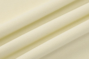 Vue détaillée de la texture du tissu en maille beige doux à haute densité