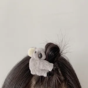 Cute plush koala hair clip in grey and white soft fabric for lovely hairstyles