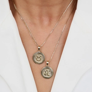 18k gold plated brass zodiac coin pendant necklace with Leo and Taurus symbols