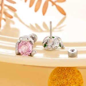 Snake wrap stud earrings with rose cut pink stone and polished stainless steel finish