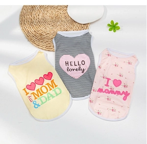 Detailed view of three cotton summer dog vests in yellow, striped, and floral prints
