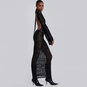 Detail of sexy backless knit maxi dress with long sleeves and elegant side slit