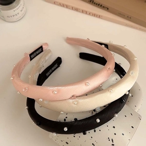 Three-piece set of silk-like headbands with pearls and crystals in pink, beige, and black