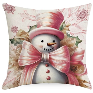 Detail of soft fabric cushion cover featuring a cartoon snowman with a pink hat and bow