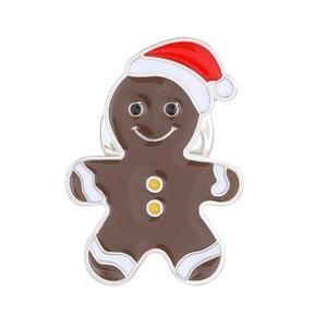 Cartoon gingerbread man enamel brooch with red Christmas hat on white background