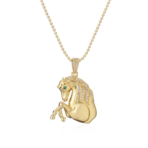Golden horse pendant necklace with sparkling cubic zirconia on white background