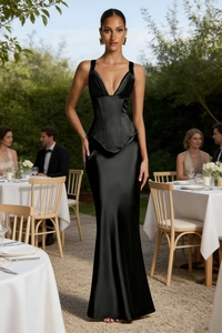 Detail of elegant black satin evening dress with corset waist and V-neckline