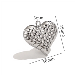 Macro view of silver heart pendant with textured grid showing 30mm width dimensions