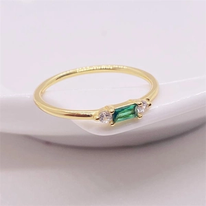 Elegant 18K gold plated S925 silver ring featuring emerald cut green zircon and side stones
