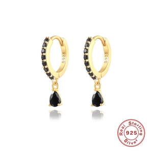 Detailed macro of S925 sterling silver hoop earrings with pear-cut black drop gemstones