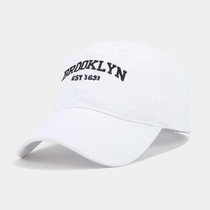 Detail of Brooklyn EST 1631 embroidery on a washed vintage baseball cap in white cotton