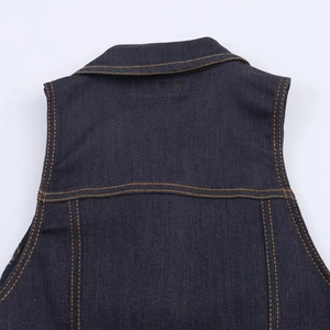 Detail view of dark blue denim bodysuit with premium orange contrast double stitching