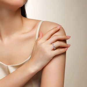 Elegant silver chain link ring for women with pave set moissanite stones on neutral background